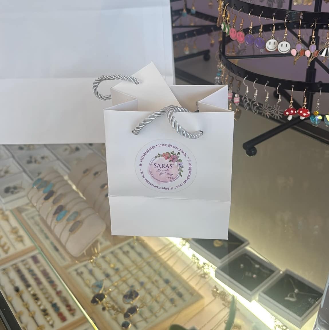 Saras Beads Bag with logo