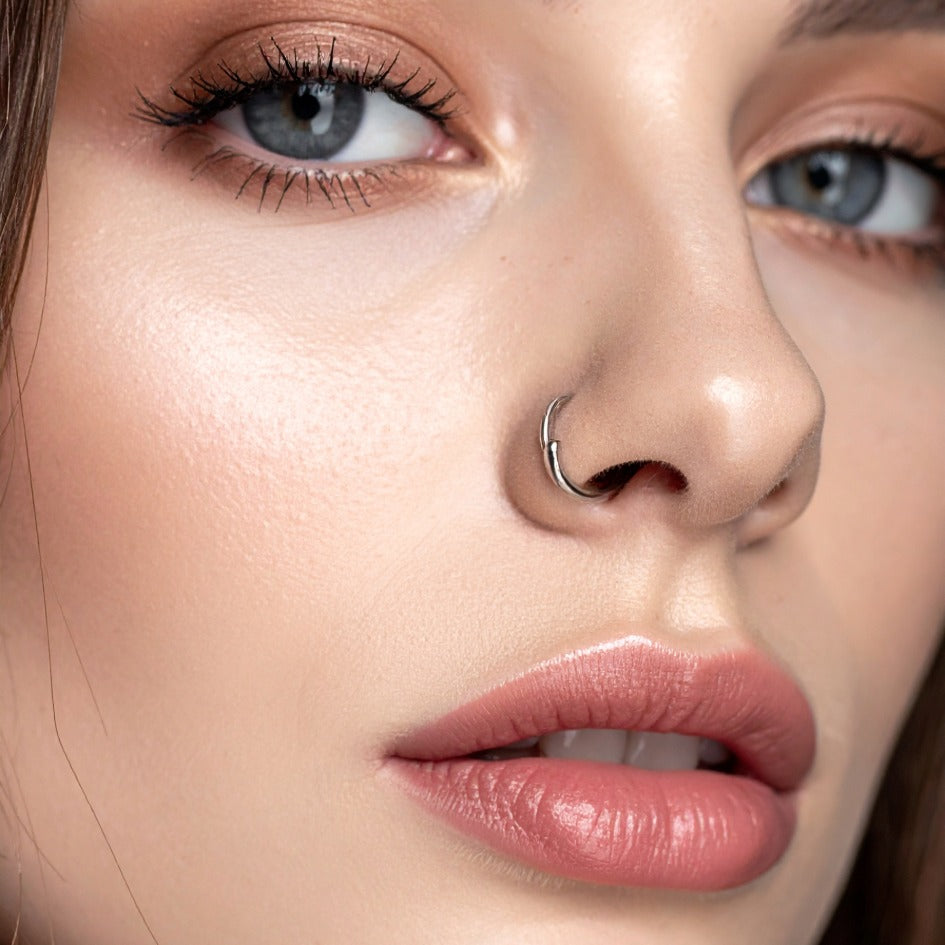 Nose rings come in various designs, including nose hoops, nose studs, and traditional rings, catering to different tastes and preferences. 