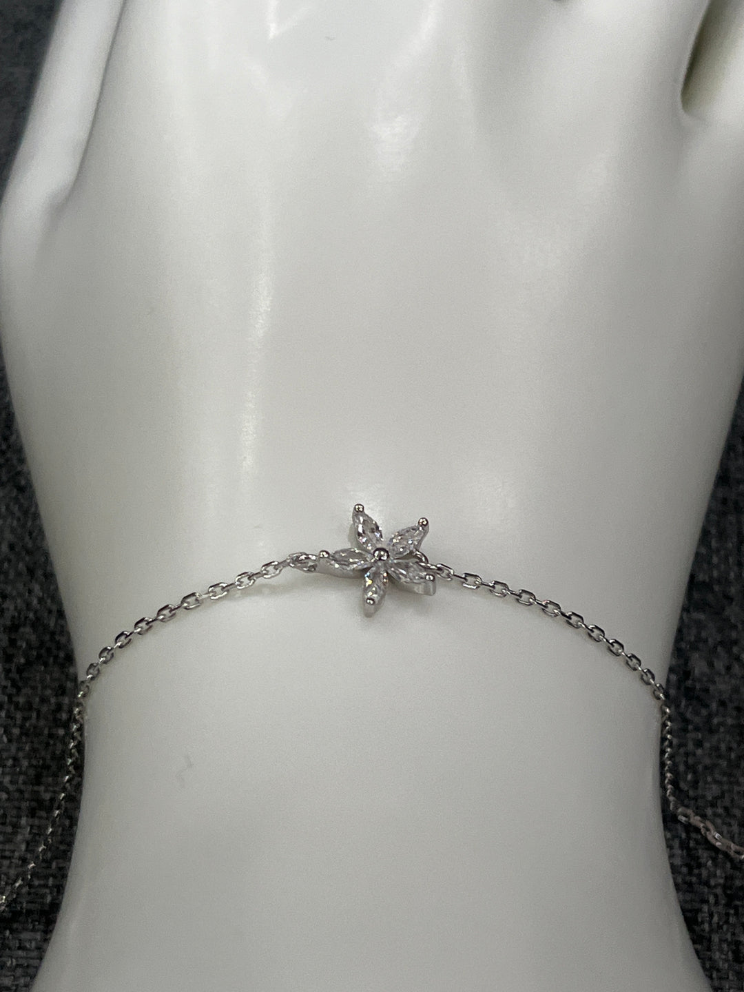 Sterling Silver Bloom Star Bracelet – A Radiant Touch of Elegance