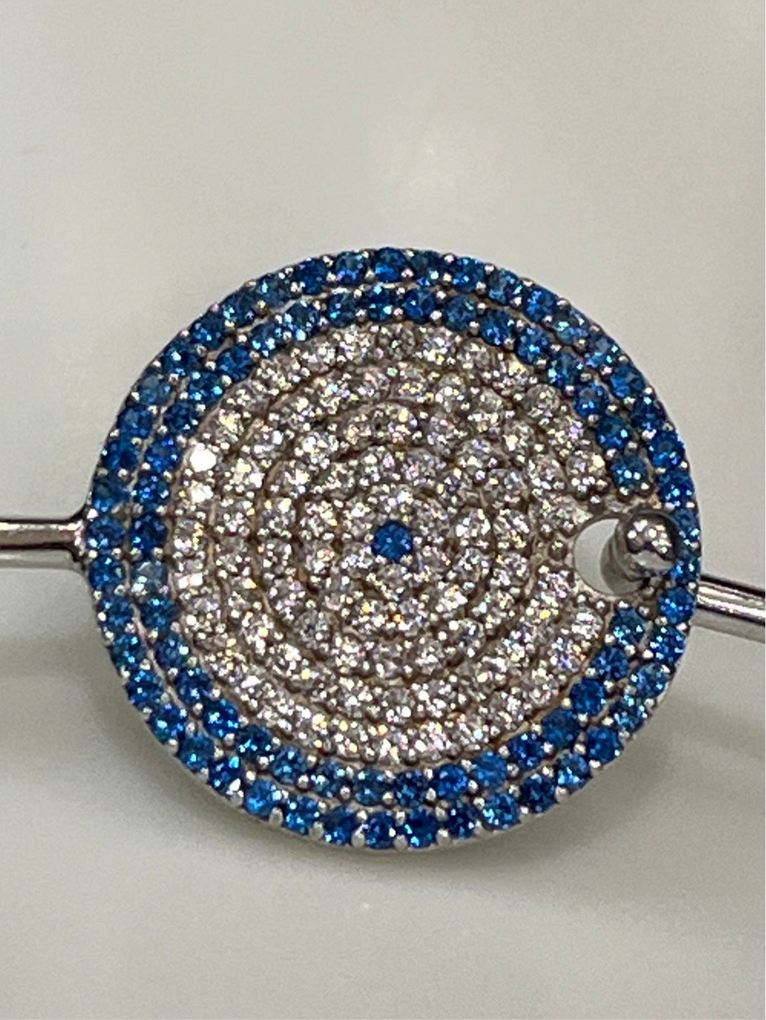 Sapphire Cascade: Sterling Silver Bangle with Blue Zirconia and Diamond Layers