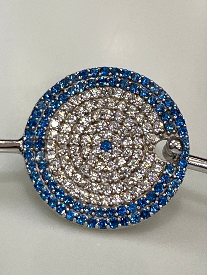 Sapphire Cascade: Sterling Silver Bangle with Blue Zirconia and Diamond Layers