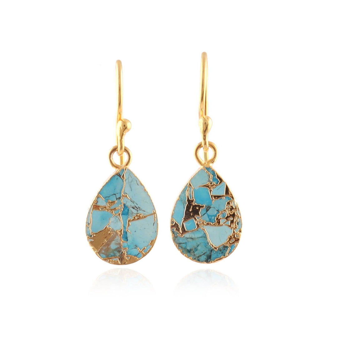 Turquoise teardrop earrings with gold accents on a white background