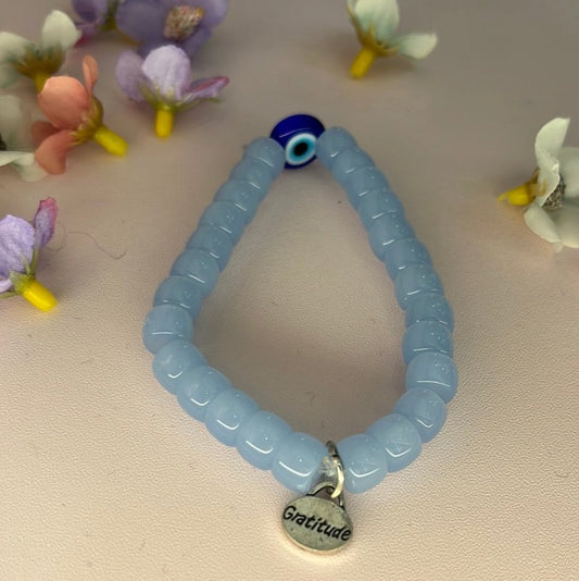 Harnessing Protection and Strength: Handcrafted Light Blue Evil Eye Stone