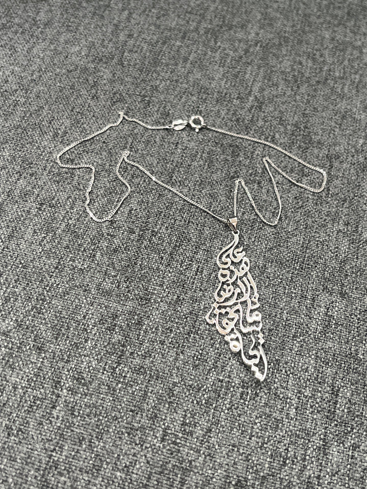 Engraved in Arabic Palestine Map Necklace – A Symbol of Heritage and Identity: On this land it is worth living