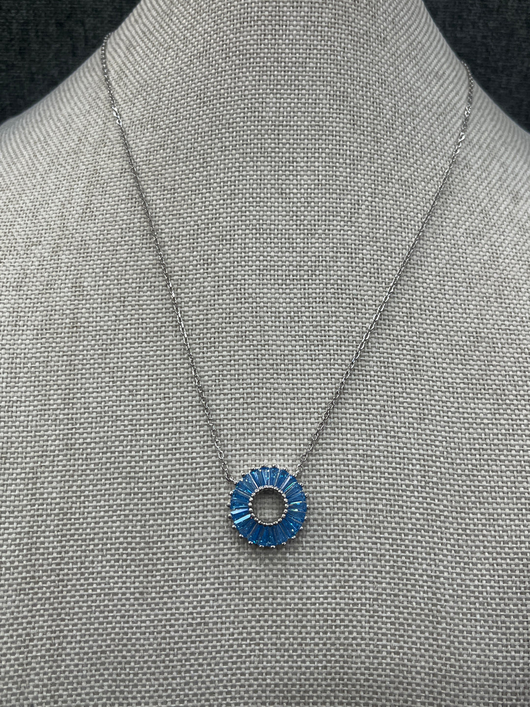 Celestial Elegance: Sterling Silver Necklace with Shiny Blue Orbit Design