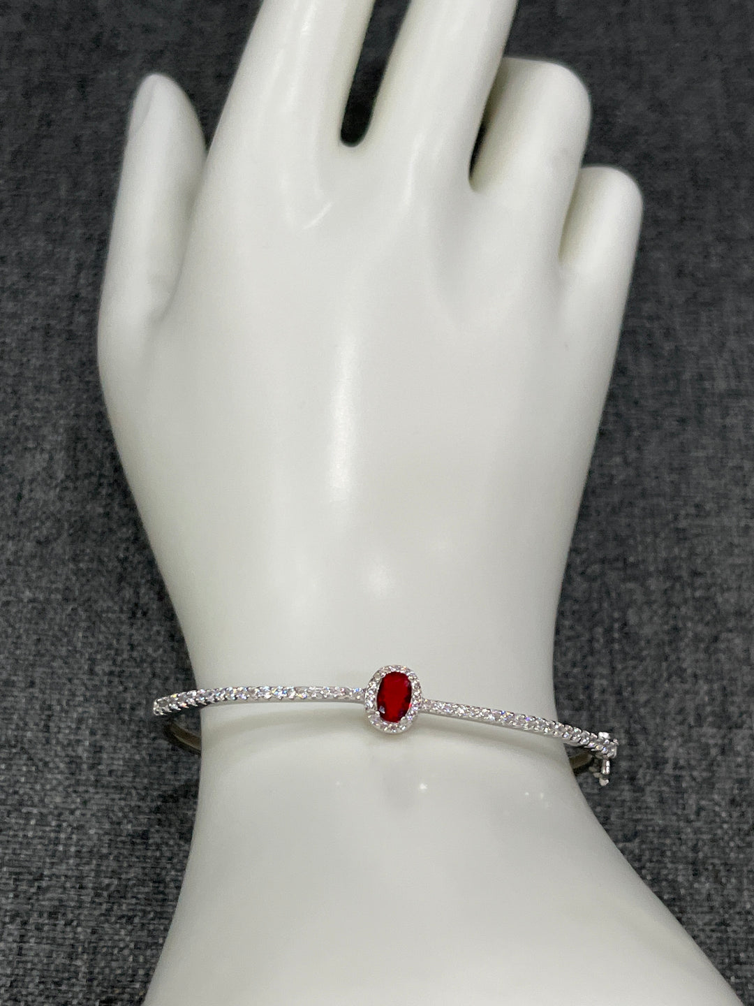 Sterling Silver Bangle with Ruby Zirconia – Classic Elegance with a Modern Twist