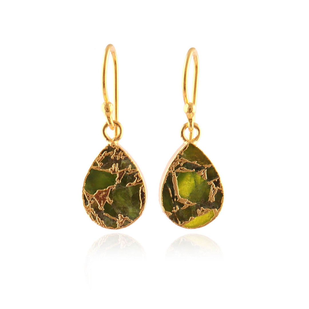Gold earrings with green teardrop-shaped stones on a white background