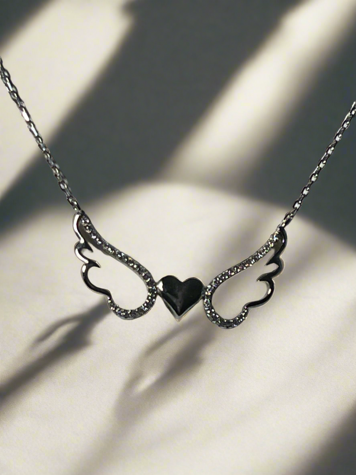 Divine Love: Rhodium-Plated Sterling Silver Angel with Heart Necklace