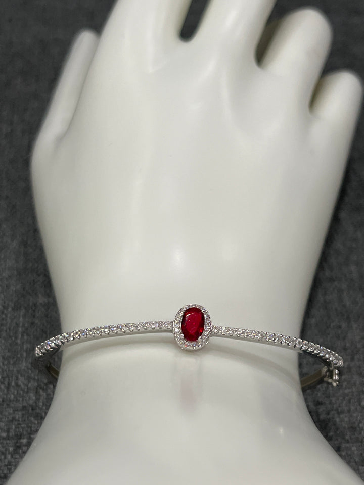 Sterling Silver Bangle with Ruby Zirconia – Classic Elegance with a Modern Twist