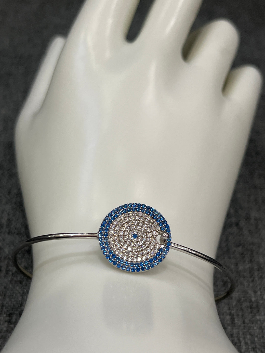 Sapphire Cascade: Sterling Silver Bangle with Blue Zirconia and Diamond Layers