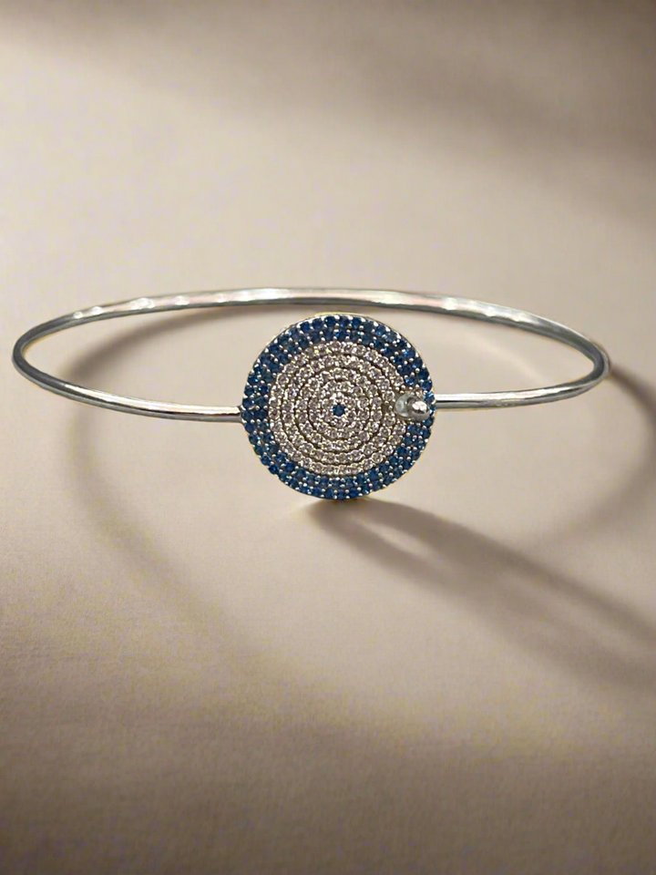 Sapphire Cascade: Sterling Silver Bangle with Blue Zirconia and Diamond Layers