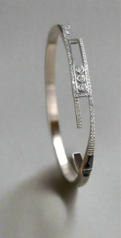 Trinity Sparkle: Rhodium-Plated Sterling Silver Bangle with Triple Dot Zirconia