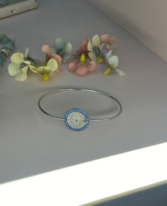 Sapphire Cascade: Sterling Silver Bangle with Blue Zirconia and Diamond Layers