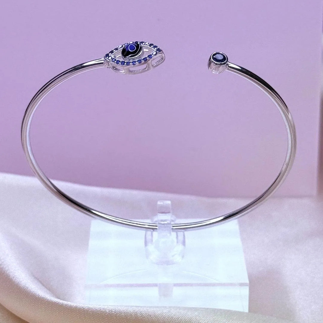 Sterling Silver Bangle with Evil Eye Charm – Protection and Style Combined