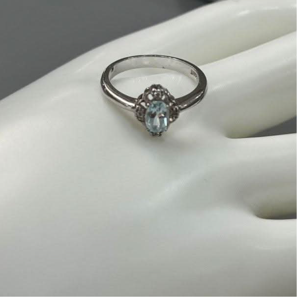 Enigmatic Blue Topaz: Sterling Silver Shiny Ring