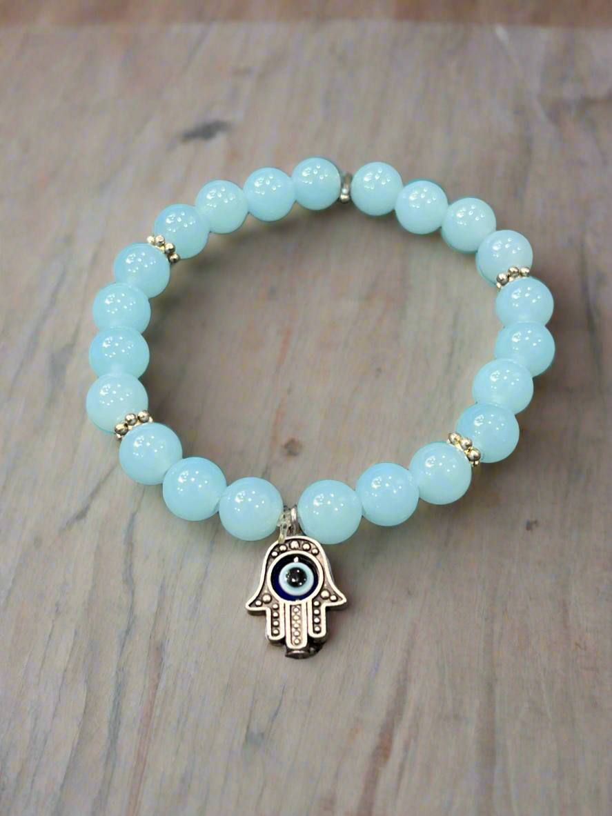 Harnessing Protection and Strength: Handcrafted Turquoise & Hamsa Evil Eye Stone