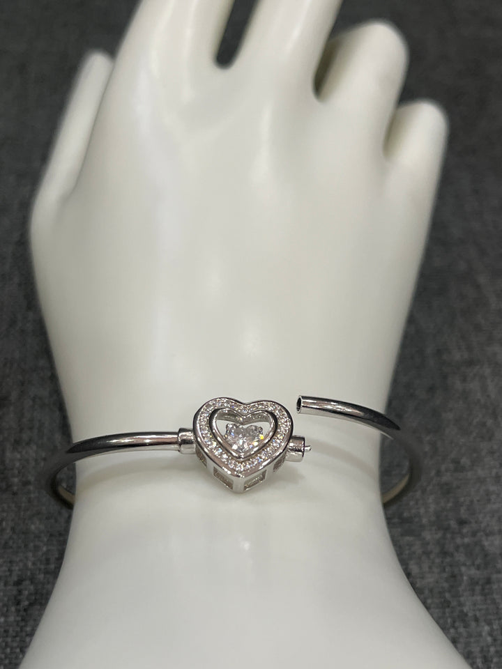 Heartfelt Radiance: Sterling Silver Heart Bangle