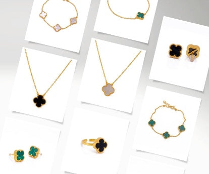 Collection of gold and black jewellery on white cards Saras Beads UK