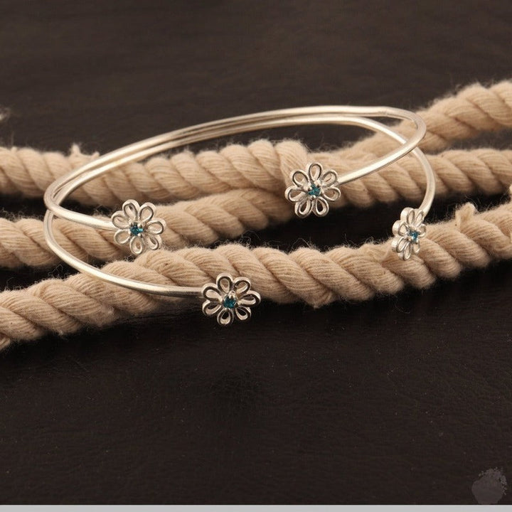 Emerald or a Blue Topaz Four Daisies Bangle