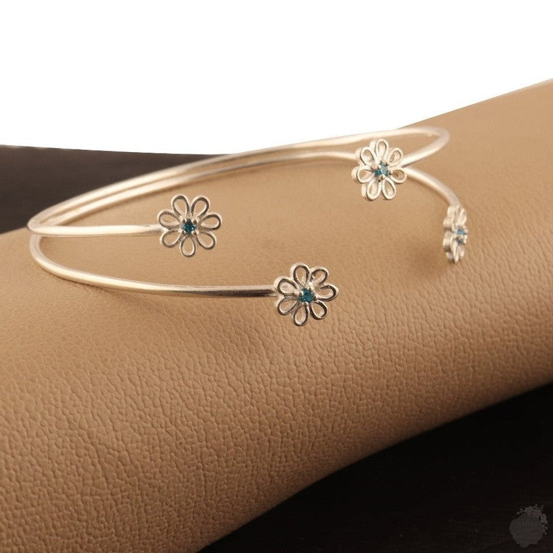 Emerald or a Blue Topaz Four Daisies Bangle