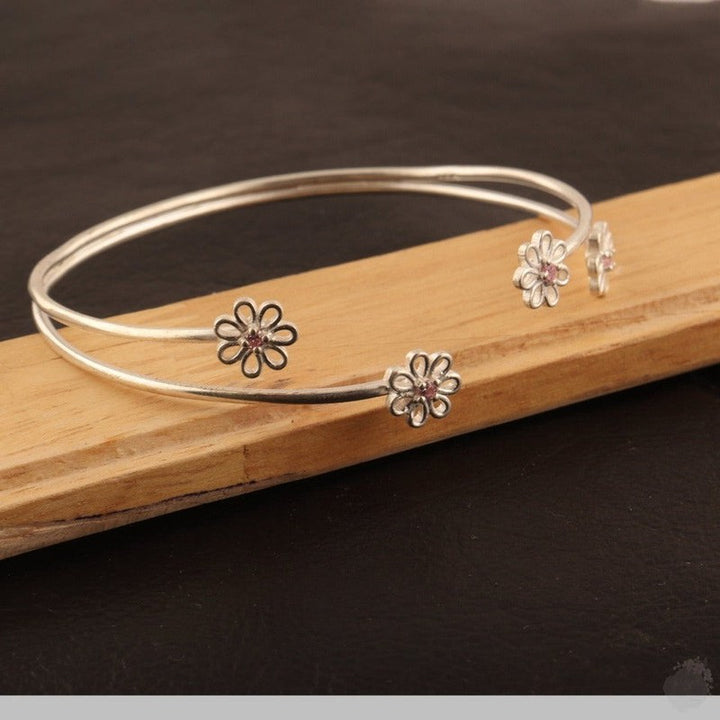 Emerald or a Blue Topaz Four Daisies Bangle