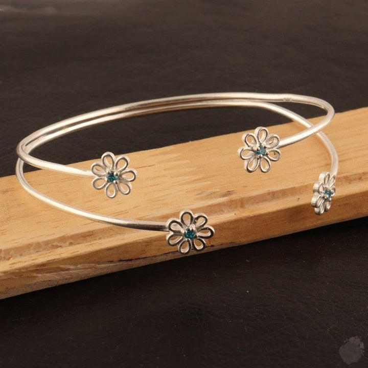 Emerald or a Blue Topaz Four Daisies Bangle