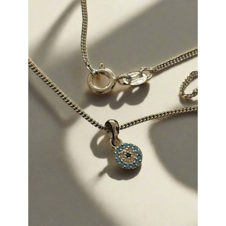 Enigmatic Elegance: Sterling Silver Tiny Evil Eye Necklace