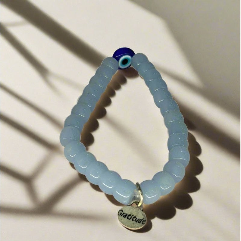 Harnessing Protection and Strength: Handcrafted Light Blue Evil Eye Stone