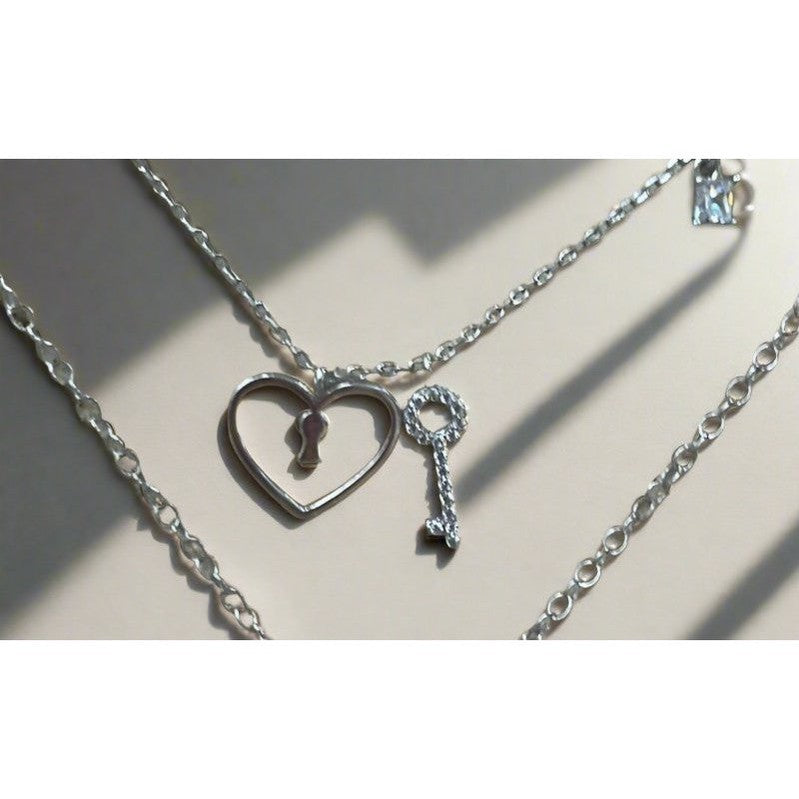 Key to Love: Sterling Silver Shiny Necklace with Heart and White Gem