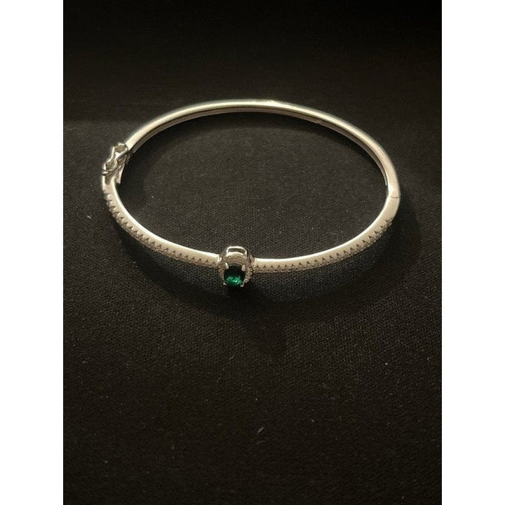 Sterling Silver Bangle with Emerald Zirconia – Classic Elegance with a Modern Twist