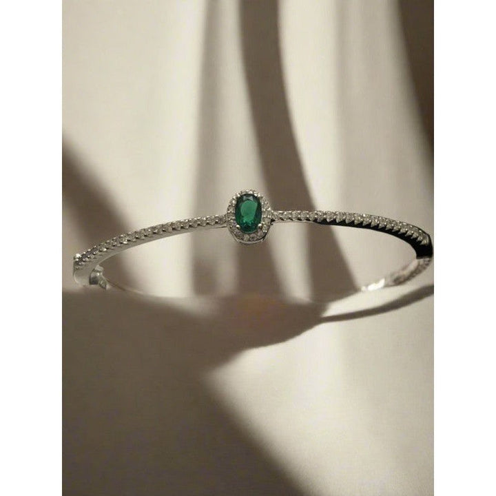 Sterling Silver Bangle with Emerald Zirconia – Classic Elegance with a Modern Twist