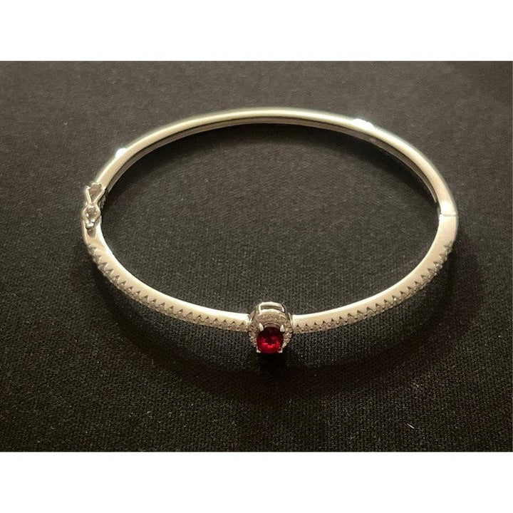 Sterling Silver Bangle with Ruby Zirconia – Classic Elegance with a Modern Twist