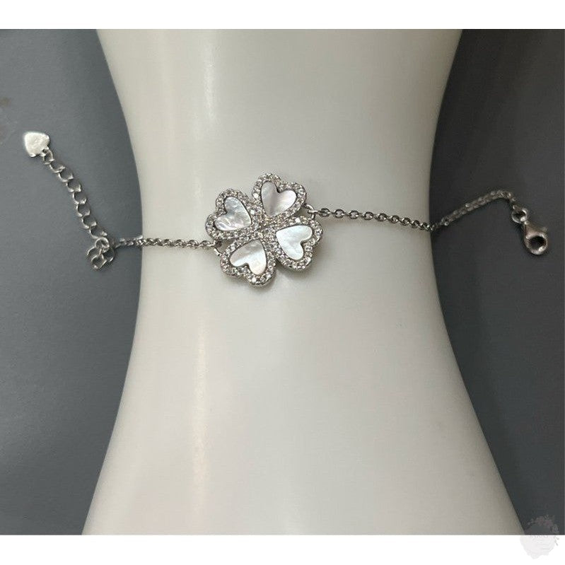 Timeless Elegance: The Sterling Silver Four-Petal Flower Bracelet