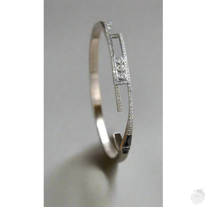 Trinity Sparkle: Rhodium-Plated Sterling Silver Bangle with Triple Dot Zirconia